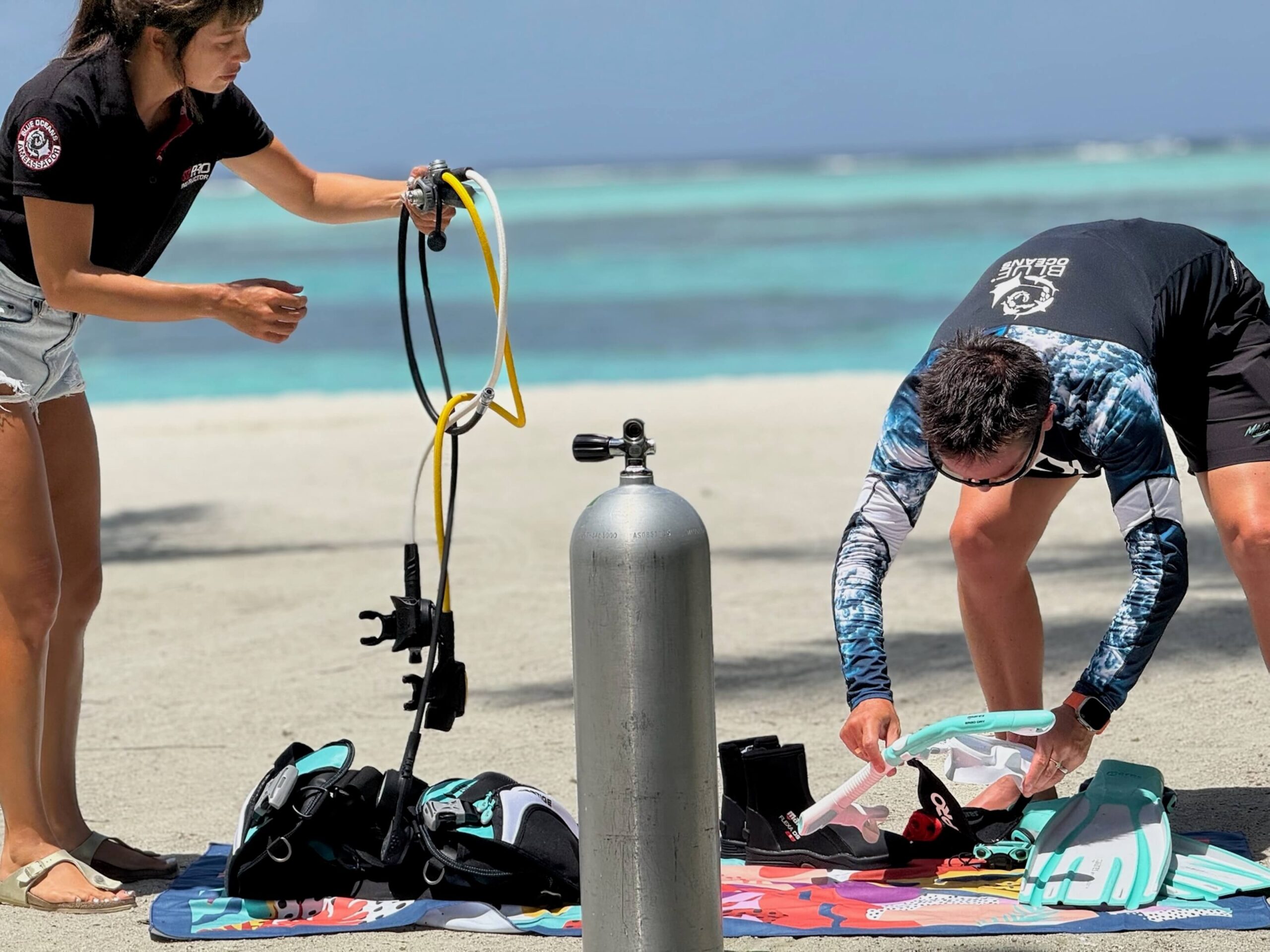 Dive professional preparing equipment before starting a PADI IDC vs SSI ITC 
